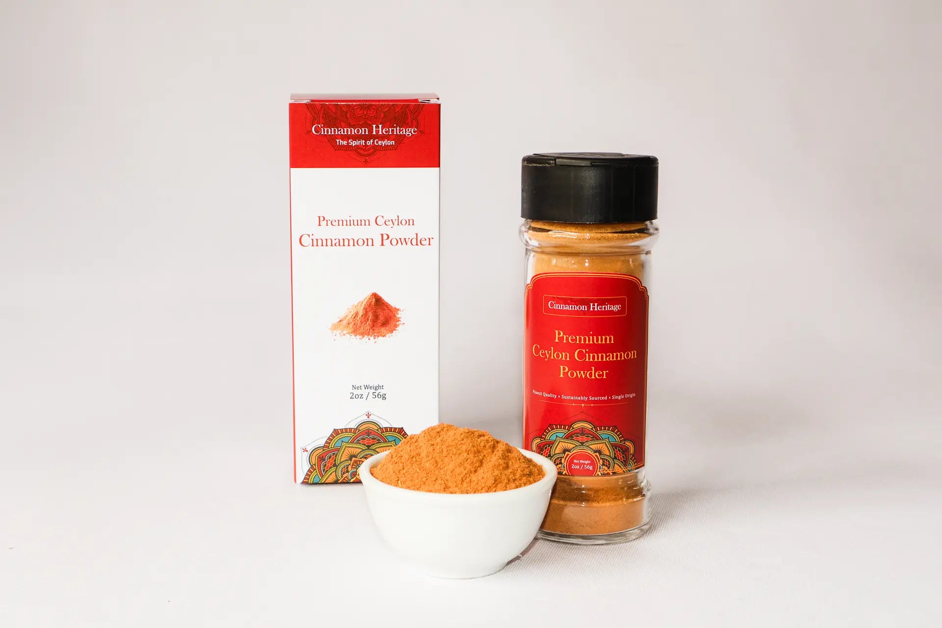 Cinnamon Heritage Ceylon Cinnamon powder packaging with a bottle and a bowl of cinnamon powder on a white background