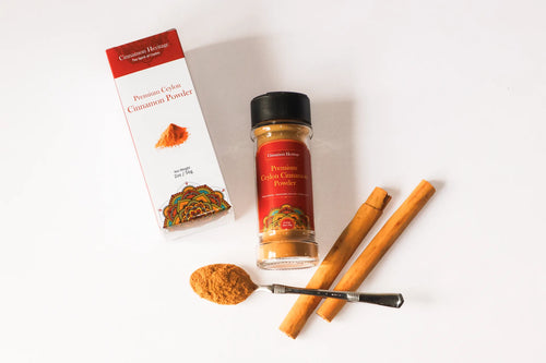 Ceylon Cinnamon powder packaging with cinnamon sticks and a spoonful of powder on a white background. Highest quality ceylon cinnamon.